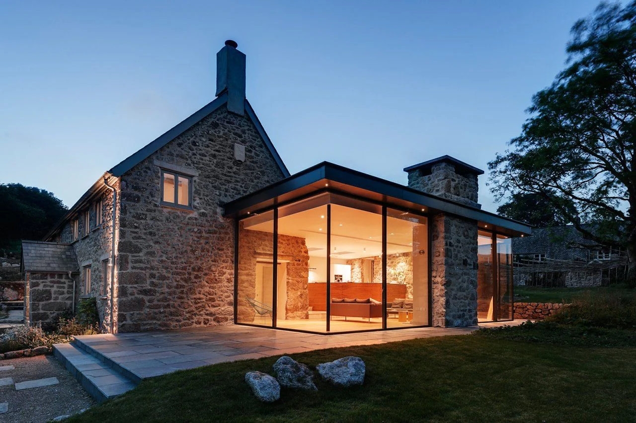 Glazed extension at dusk, featured by LTJ Architecture