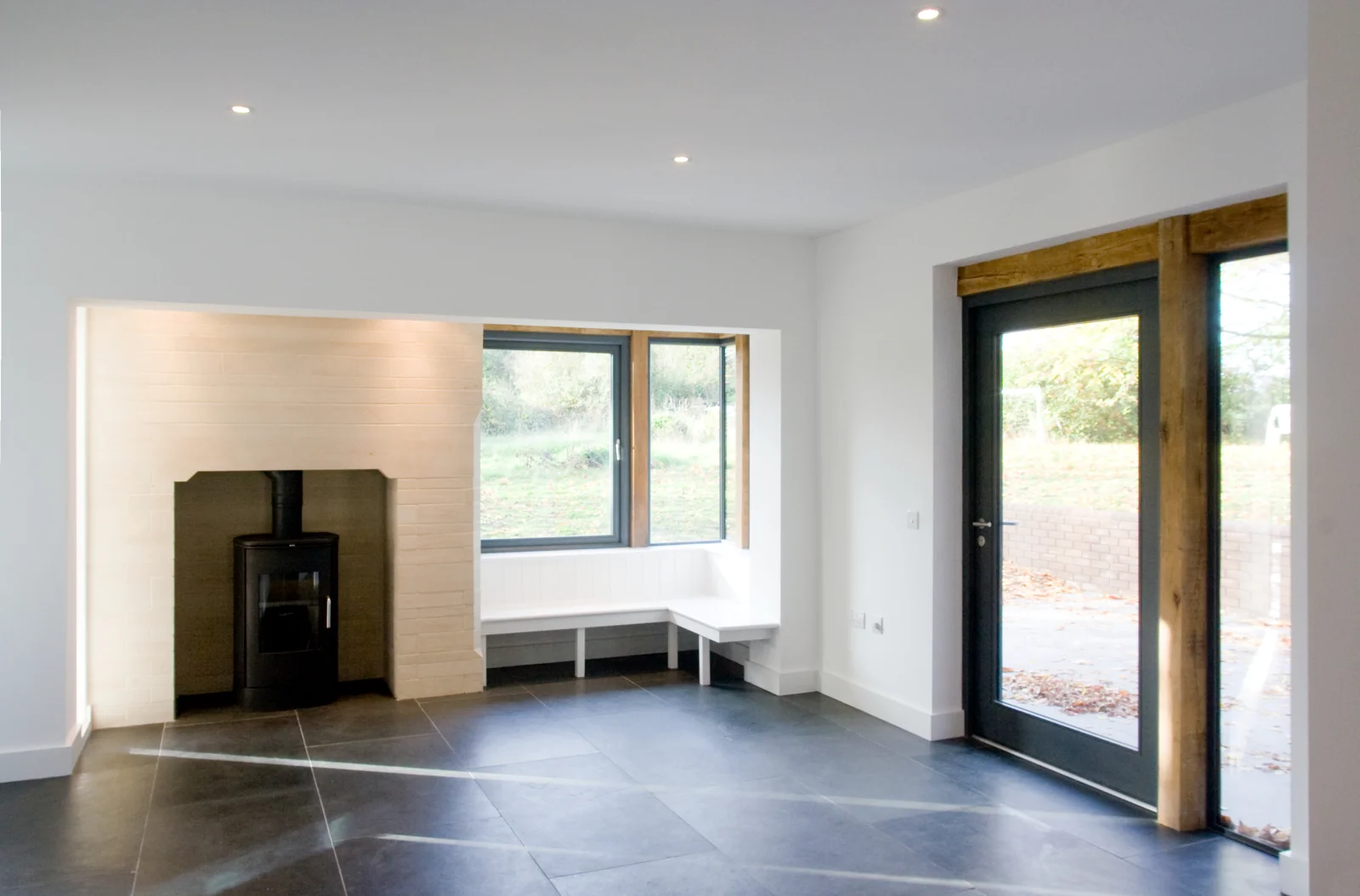 Living space opening onto the garden at October House