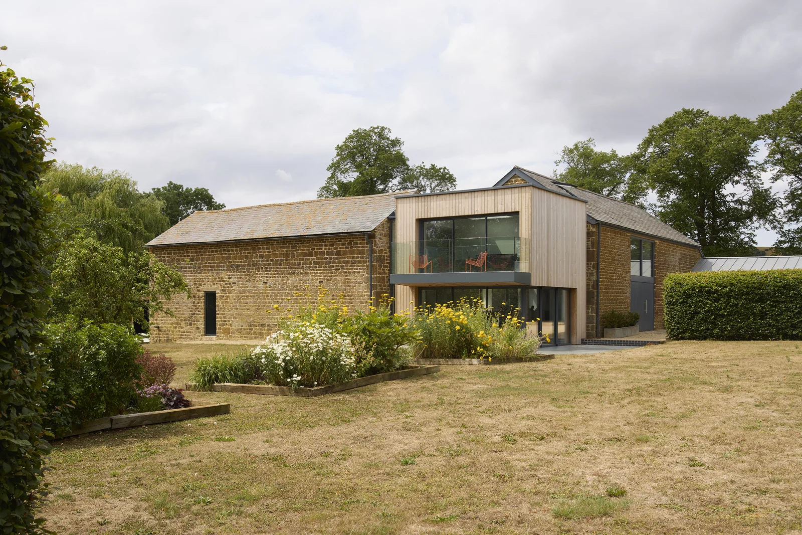 Stone buildings and garden setting at Rough Hill Farm