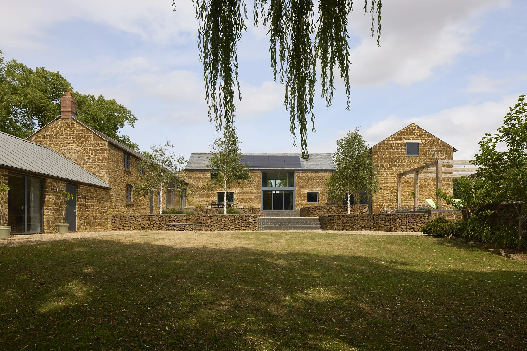 Rough Hill Farm stone buildings around a landscaped courtyard
